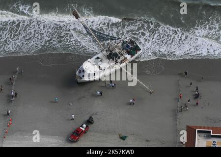 Myrtle Beach, United States. 01st Oct, 2022. Aerial view of the beached shrimp trawler Shayna Michelle run aground on a public beach in the aftermath of the Category 1 Hurricane Ian, October 1, 2022 in Myrtle Beach, South Carolina. The storm surge from Hurricane Ian pushed the ship onto a beach along the Grand Strand. Credit: Sgt 1st Class Roby Di Giovine/US Army/Alamy Live News Stock Photo