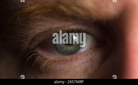 Close up of males eye being relaxed Stock Photo