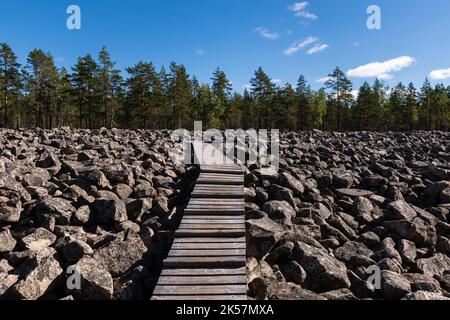 Wooden walkway across the Boulder field, Kivijata in Lauhanvuori National Park, Isojoki, Finland. Stock Photo
