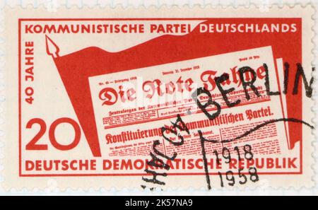Photo of a postage stamp from East Germany for the 40th anniversary of the communist party Die Rote Fahne The Red Flag issued 1958