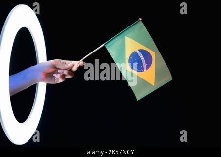 brazil flag patriotic identity fan hand on black Stock Photo