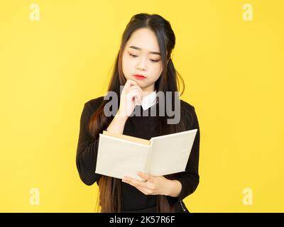 smart student book reading clever thinking girl Stock Photo