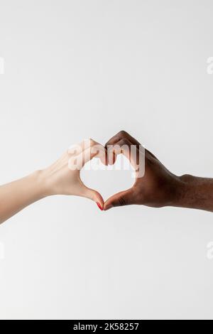 Diversity and inclusion as a Heart shape made from diverse multicultural  hands as a group of different people hands connected together shaped as a  symbol of social unity Photos