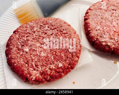 Two raw hamburger patties prepped for the grill, 2022, USA Stock Photo