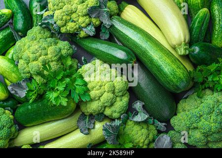 Assortment of ripe green vegetables from broccoli, zucchini and cucumbers. Stock Photo