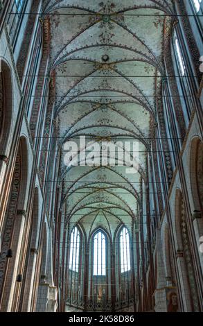 Germany, Lubeck - July 13, 2022: Marienkirche. Ceiling over apse, chancel and nave with lots of vertical supporting lines of pillars Stock Photo