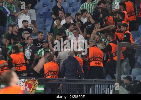 Rome, Italy. 06th Oct, 2022. ROME, Italy - 06.10.2022: Fight between fans and stewarts in the stands during the UEFA Europe League group C match between AS Roma and Real Betis Seville at the Olympic Stadium on October 10, 2022 in Rome, Italy. Credit: Independent Photo Agency/Alamy Live News Stock Photo