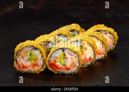 Tempura Maki Sushi Deep Fried Sushi Roll on black background Stock Photo