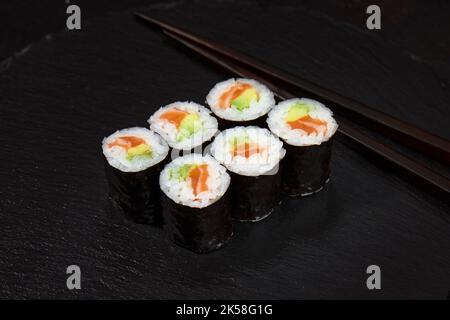 Set of tuna sushi rolls on black desk background Stock Photo