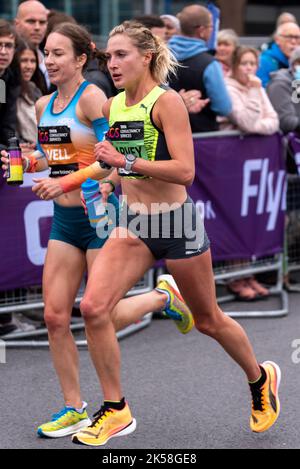 Stephanie Twell and Rose Harvey racing in the TCS London Marathon 2022 Elite Women race in Tower Hill, City of London, UK. British female runners Stock Photo