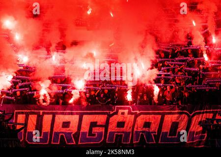 Gent, Belgium, 06/10/2022, Djurgardens' supporters pictured with fireworks before a soccer match between Belgian KAA Gent and Swedish Djurgardens IF, Thursday 06 October 2022 in Gent, on day three of the UEFA Europa Conference League group stage. BELGA PHOTO JASPER JACOBS Stock Photo