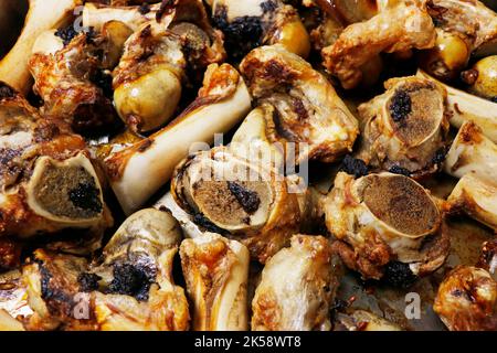 roasted veal marrow bone or beef bone from the oven for stock or sauce preparation Stock Photo