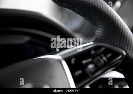 The Up Shift Paddle On The Multifunction Steering Wheel Of A 2020 Audi RS6 Avant Automatic Gearbox Stock Photo