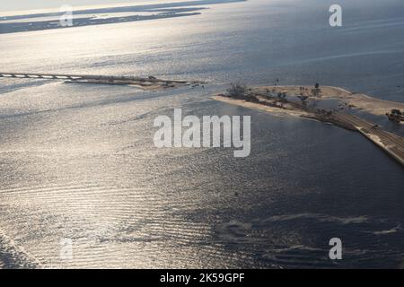 Aerial shot showing damage caused by Hurricane Ian to the Sanibel Causeway near Cape Coral, Florida, October 3, 2022.  The causeway, which is temporarily closed, is the only land-travel access road between Sanibel Island and mainland Florida. (U.S. Army National Guard photo by Sgt. Jovi Prevot) Stock Photo