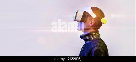 Man is using virtual reality headset. Concept of virtual, augmented and extended reality, metaverse, entertainment and communication. Stock Photo
