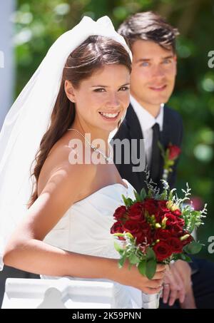 The light of his life. A newly married couple walking out the chapel in the bright sunlight. Stock Photo