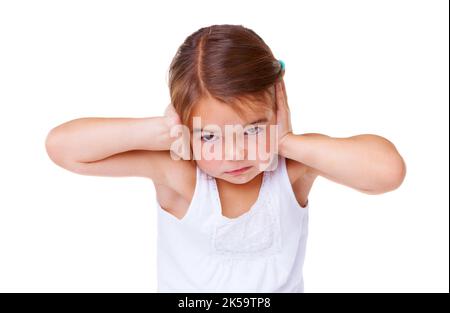 Can you make it softer. Portrait of a little girl covering her ears. Stock Photo