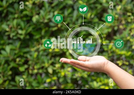 hand with environmental icons CO2 emission reduction icons global warming sustainable development and green business renewable energy clean and friend Stock Photo