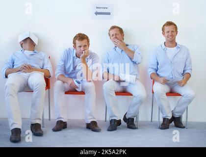 Enthusiasm waning. Conceptual image of a young man being kept waiting for an interview. Stock Photo
