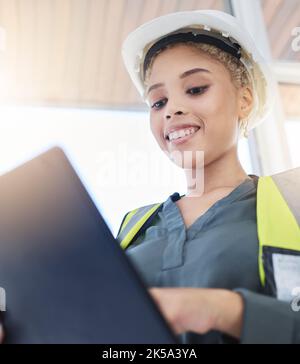 Construction, manager and black woman worker with a tablet logging data and information. Building boss, digital and internet work of a management Stock Photo