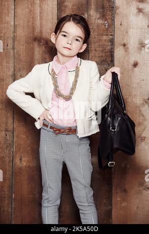 Shes got the look. Portrait of an adorable little girl dressed fashionably. Stock Photo