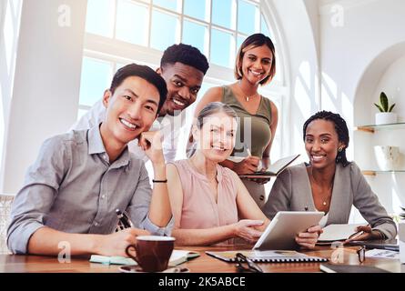Diversity, team and business meeting for planning, research and strategy together in office at desk. Multiracial, brainstorm and group working on Stock Photo