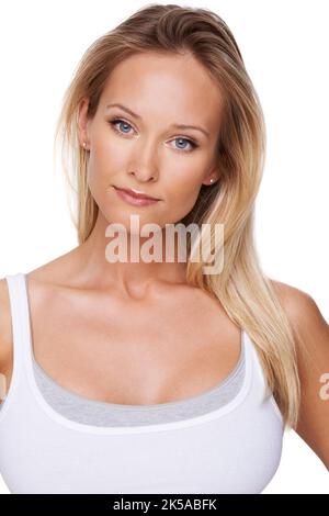 Stern beauty - Serious about her wellbeing. Portrait of a beautiful blond woman isolated on a white background. Stock Photo