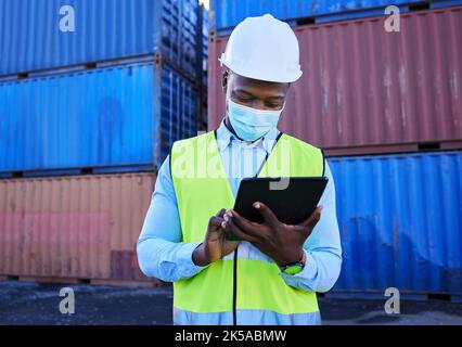 Tablet, logistics and worker with mask for covid safety working with digital checklist for international and global shipping. Cargo, container and Stock Photo