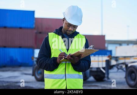 Engineer, cargo and black man writing shipping or delivery inspection report for control at shipyard by warehouse foreman. African supply chain worker Stock Photo