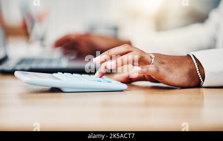 Accountant doing budget planning, money and finance management and bookkeeping or tax. Black woman using calculator, laptop and financial accounting Stock Photo