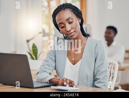 Accounting, business and black woman typing on calculator while working on the web in office at work. African accountant working and planning in Stock Photo