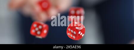 Red dice flying over casino chips closeup Stock Photo