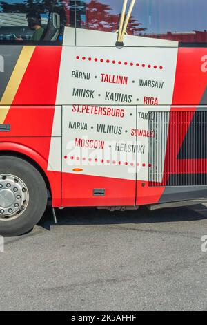 Busstation of St. Petersburg with sign on bus to Helsinki, Tallin, Vilnus, Riga. vertical Stock Photo