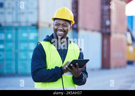 Logistics, tablet and black man shipping cargo on the internet while working at an outdoor warehouse. African industrial engineer thinking of strategy Stock Photo