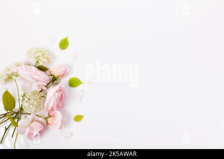 Festive flower composition on the white background. Overhead view Stock Photo