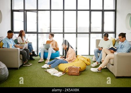 Education, studying and students meeting for project collaboration, teamwork or research planning in university workspace. Design, creativity and Stock Photo