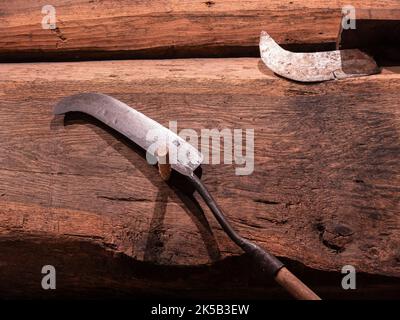 Old metal blade for pruning and chopping vines in a vineyard Stock Photo