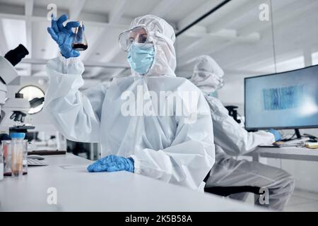 Blood, covid and doctors in a science laboratory testing dna and rna to research, analysis and analyze the chemistry. Medical scientists in hazmat Stock Photo