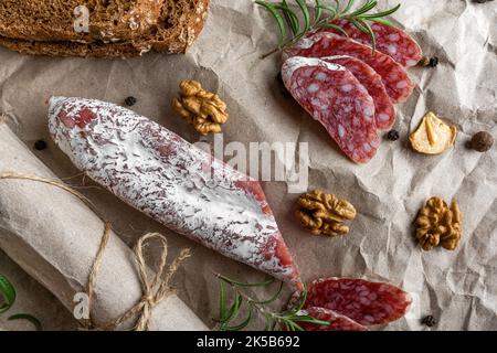 Sausage and bread and spices on the table. Stock Photo