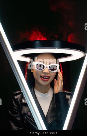 tech fashion cyberpunk people neon girl in glasses Stock Photo