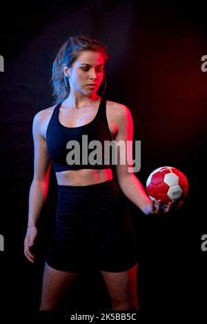 Female model with fitness outfit inside studio Stock Photo