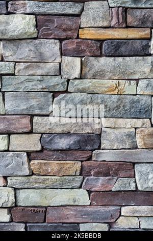 Decorative brown and grey stone setting. Cut stone wall texture. Stock Photo