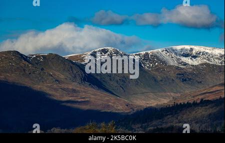 The fells on Windermere's west shore, still coated in the snow that the winter of 2017 brought with it. Stock Photo