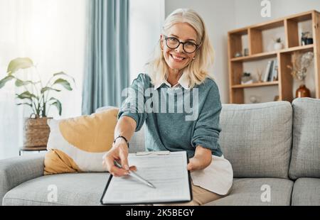 Therapy documents, consultation and senior psychologist consulting with paperwork in office at a clinic. Portrait of a mature healthcare therapist Stock Photo