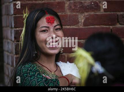 Kathmandu, Bagmati, Nepal. 7th Oct, 2022. A Nepali girl smiles as she celebrate after receiving Tika on forehead and jamara during Dashain festival on October 7, 2022. (Credit Image: © Sunil Sharma/ZUMA Press Wire) Stock Photo