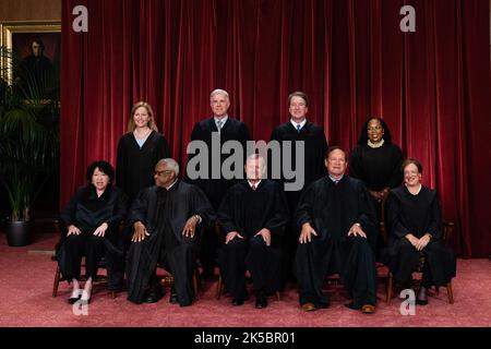 Justices of the US Supreme Court during a formal group photograph at the Supreme Court in Washington, DC, US, on Friday, Oct. 7, 2022. Seated from left: Associate Justice Sonia Sotomayor, Associate Justice Clarence Thomas, Chief Justice John Roberts, Associate Justice Samuel Alito Jr. and Associate Justice Elena Kagan. Standing from left: Associate Justice Amy Coney Barrett, Associate Justice Neil Gorsuch, Associate Justice Brett Kavanaugh and Associate Justice Ketanji Brown Jackson. The court opened its new term Monday with a calendar already full of high-profile clashes, including two case Stock Photo