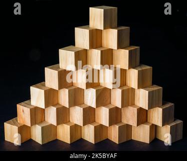 Pyramid of wood cubes. Stock Photo