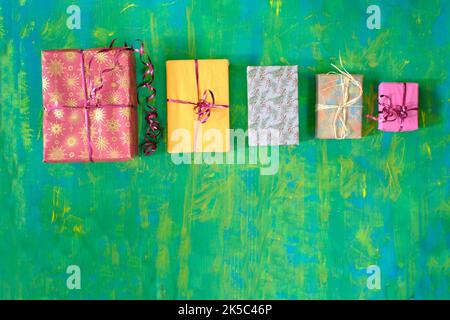 christmas gifts in a row, wrapped presents, merry christmas,making a present concept,free copy space Stock Photo