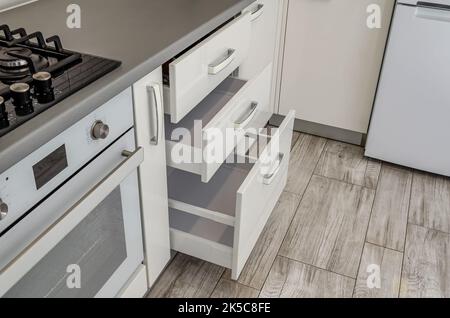 White kitchen set, bedside table with drawers. Stock Photo
