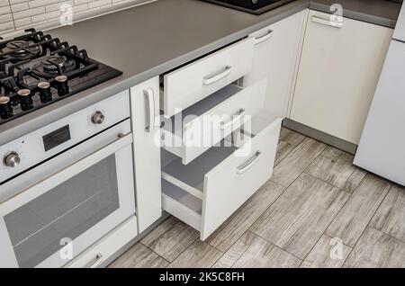 White kitchen set, bedside table with drawers. Stock Photo